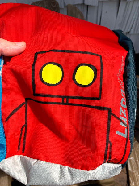Red Robot and Dogs on a backpack